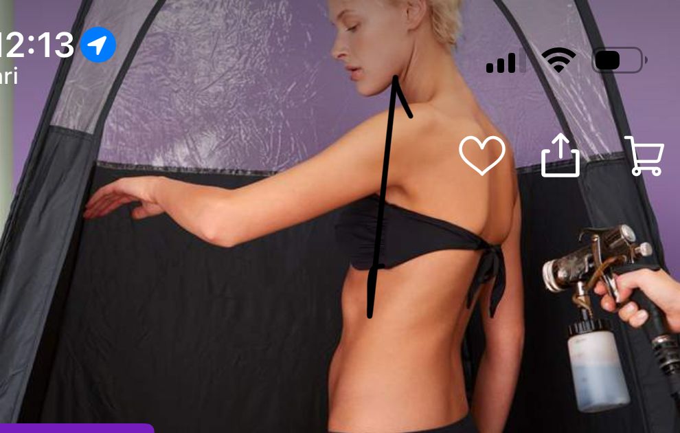 Profile of a woman in a black bikini top against a dark background.
